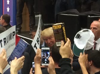 Donald J. Trump presses the fleshes, signs autographs.