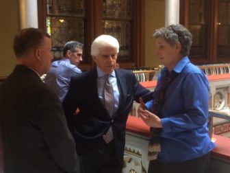 William A. DiBella, center, lobbies Sens. Beth Bye and Tim Larson on bottled water bill.