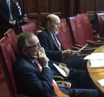 Sen. Andrew Maynard, left, listening to tributes Wednesday.