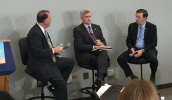 At the mental health summit, Sen. Chris Murphy, right, and co-sponsor Sen. Bill Cassidy of Louisiana, center, speak with Virginia State Sen. Creigh Deeds whose mentally ill son attacked him before committing suicide.