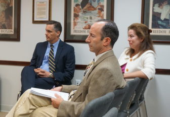 Deputy Attorney General Perry Zinn-Rowthorn, left, elections lawyer Johua Foley and Assistant AG Maura Murphy Osborne before the SEEC went into executive session.