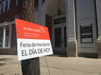 A sign outside the women's center in Danbury directs Access Health CT customers to the transition enrollment fair Wednesday afternoon.