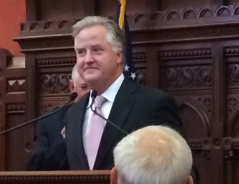 J. Brendan Sharkey listens to tributes from House colleagues praising his service as speaker.
