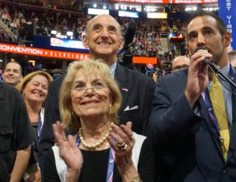 Pat Longo and Charles Glazer stood with J.R. Romano as Connecticut cast its vote in July.