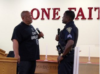 Connecticut NAACP President Scot X. Esdaile and New Haven Police Sgt. Shafiq Abdussabar engage in dialogue during a police-community forum in New Haven on July 22. This is one of several such forums that have taken place across Connecticut in the wake of police shootings and the killing of unarmed black men.