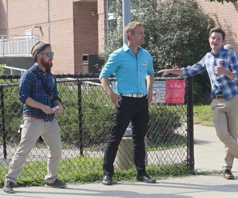Joshua Elliott, center, at the polls. At left is a Working Families field worker.