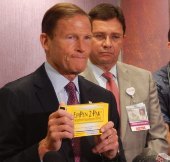 U.S. Sen. Richard Blumenthal holds an EpiPen two-pak box during a recent press conference in Hartford.