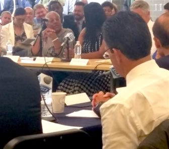 Governor Dannel P Malloy, foreground, listens as Elizabeth Elizabeth Horton Sheff, center, discusses the need to get past the current stalemate in further integrating schools.