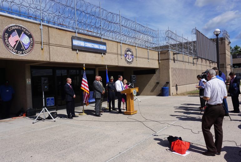 Gov. Dannel P. Malloy announced a prison population milestone outside a correctional facility in Hartford.
