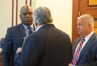 Lockheed Martin vice president Lawrence Duncan III, left, talking to Republican Reps. Charles J. Ferraro of West Haven and Ben McGorty of Shelton.