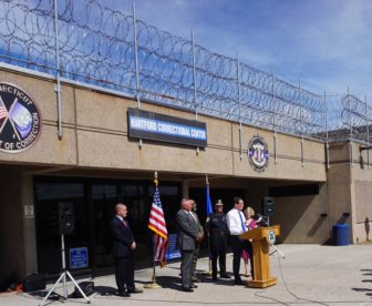 Scott Semple, second from left, joined the governor last month to talk about a prison milestone.
