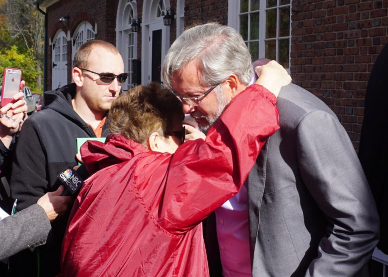 Betty Boukus hugs William Petit.