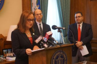 Secretary of the State Denise Merrill, Monte Russell of the Connecticut Bar Association and Michael Brandi.