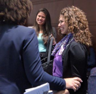 Kathryn Arroyo, right, celebrates with her sister and others after Relay is approved as a teacher preparation program, paving the way for her to become a teacher.
