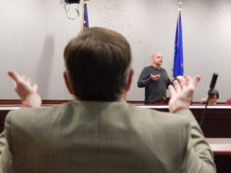 Representative-elect David Wilson participates in a grounding exercise led by Deron Drumm, executive director of Advocacy Unlimited, during a mental health training at the state Capitol Complex