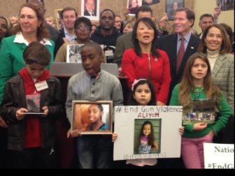 Relatives of victims of gun violence at a Washington, D.C., press conference Thursday. Joining them were members of the Connecticut congressional delegation, including Rep. Elizabeth Esty, D-5th District, at left, and Sens. Chris Murphy and Richard Blumenthal, at rear.