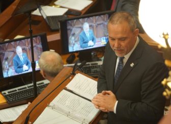 The new House speaker, Joe Aresimowicz, addresses his predecessors as speaker after taking the oath.
