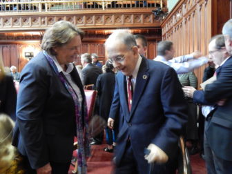 Senate President Pro Tem Martin M. Looney enters the Senate chamber on opening day of the 2017 legislative session, weeks after receiving a kidney transplant. Among those greeting him was Cathy Cook, a former Republican state Senator.