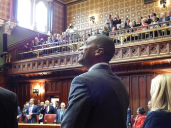 Sen. George Logan of Ansonia, looks up at people in the Senate gallery on opening day of the 2017 legislative session. Logan is one of four new Republican senators.