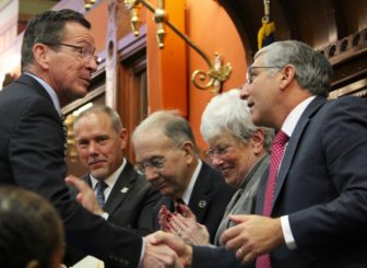 Gov. Dannel P. Malloy, left, shakes hands with State Senate Republican Leader Len Fasano. With them, from left, are new House speaker joe Aresimowicz, Senate President Pro Tem Martin Looney and Lt. Gov. Nancy Wyman.