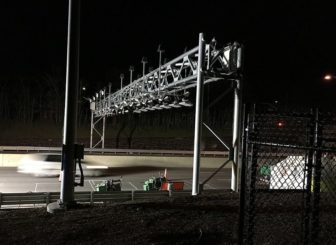 Modern tolls use overhead gantries like this one on the Massachusetts Turnpike (Arnold Reinhold / Creative Commons)