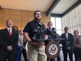 Christopher Scofield, a technician at Bradley International Airport, speaks at the press conference on Monday.