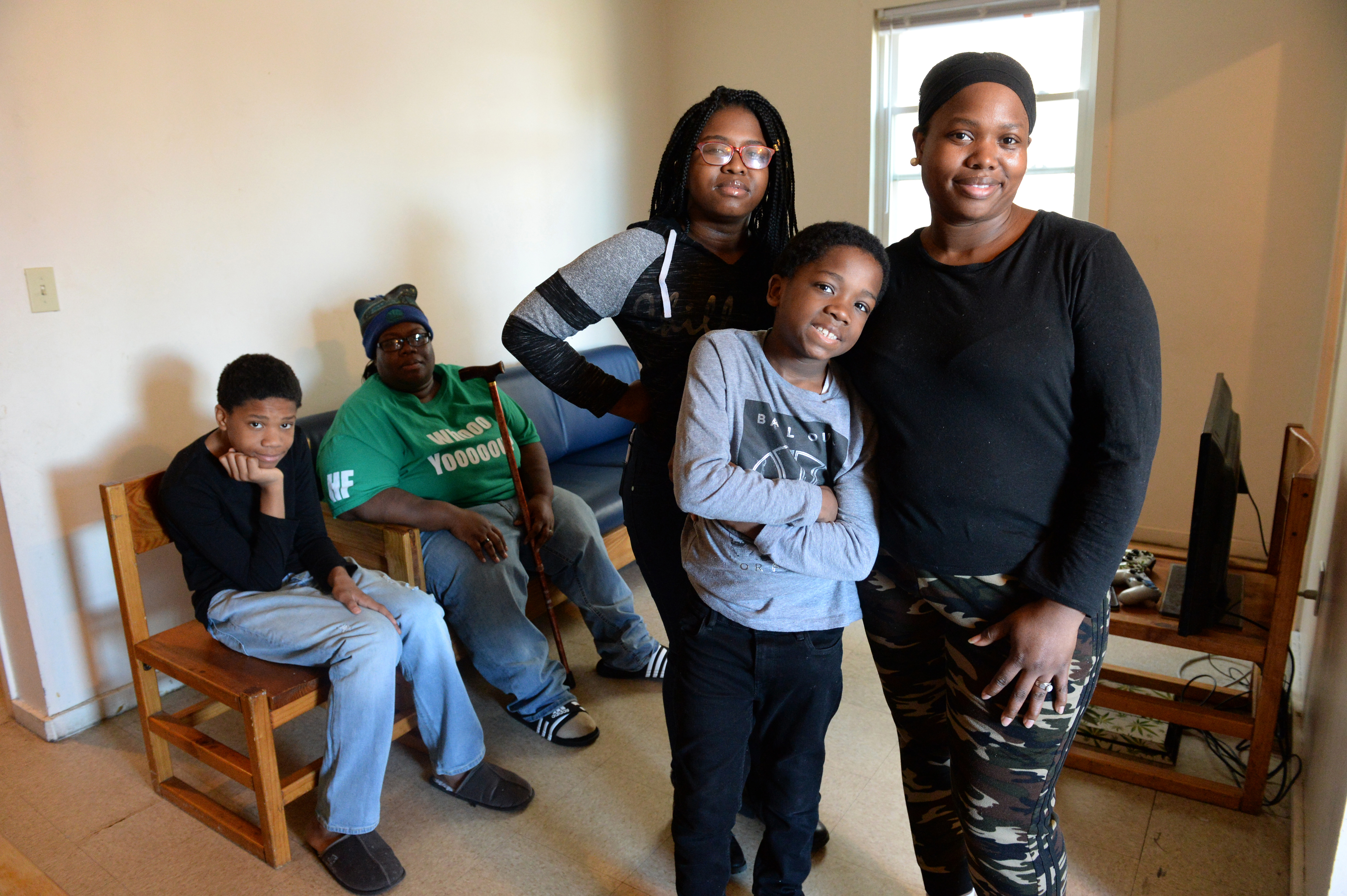 Ashana Cunningham lives with her wife, India Cunningham and her three children - Ansoneya Mitchener, 15, Robert Hallums, 12 and Brandon Mitchener, 9 - in a three-bedroom apartment in a Bridgeport shelter. Cunningham fell on hard times after being injured in a car accident that totaled her car. She had to quit her job after a two week hospital stay and now works part-time at a day care center for $12.50 per hour. Cunningham is looking for a better paying job and affordable housing for her family.