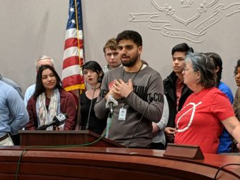 Mahmoud Mazloum, a student at Norwalk Community College, speaks out against plans to consolidate the community college at news conference Friday.