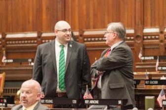 Rep. Pat Boyd, D-Pomfret, left, chats in the House chamber.