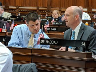Rep. Gregg Haddad, right, co-chairman of the higher education committee, confers with his vice-chair, Rep. Gary Turco, in House on Monday.